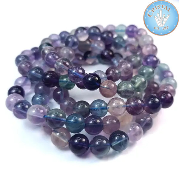 Pulsera en Fluorita, una piedra natural. Cuentas de 7 a 8 mm. Colores principales: violeta, azul y verde.