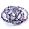 Bracelet in Fluorite, a natural stone. 6mm beads. Main color violet, and blue, green.