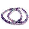 Armband aus Fluorit, einem Naturstein. 6mm große Perlen. Dominierende Farbe violett, und blau, grün.