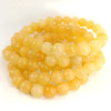 Orange Calcite Bracelet, 8 mm polished beads in yellow-orange natural stone